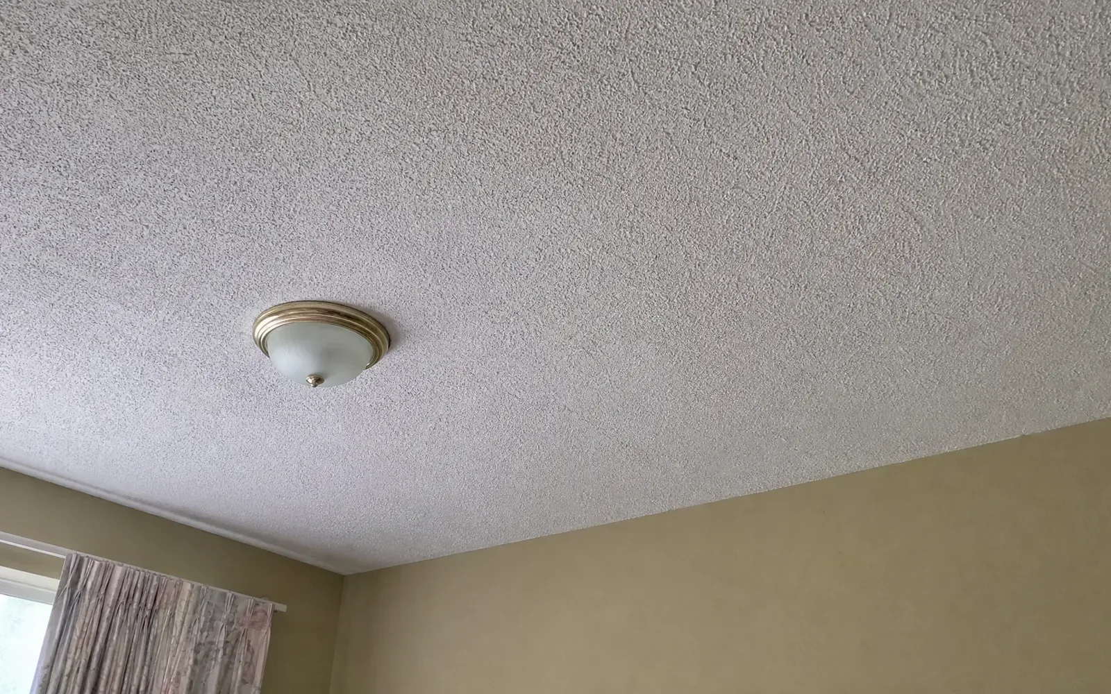 The same Austin ceiling after popcorn removal, repair and a light knockdown retexture